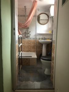 a bathroom with a toilet and a sink at Agroturystyka Chłopy in Sarbinowo +71 photos
