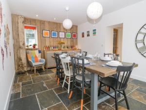 a dining room with a table and chairs at Bryn Tirion in Holyhead