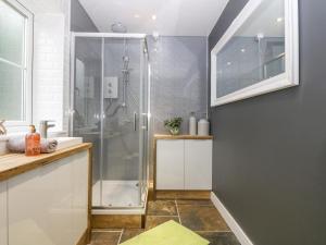 a bathroom with a shower and a sink at Bryn Tirion in Holyhead +39 photos