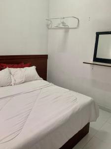 Cama o camas de una habitación en Homestay Bajet MokAji