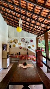 a kitchen with a table in the middle of a room at Vila Flexal Pousada in Alter do Chao