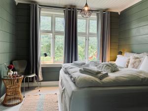 Postel nebo postele na pokoji v ubytování Monshaugen Home