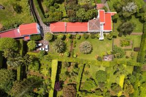 an aerial view of a house with a red roof at Azores Green Villas in Ponta Delgada