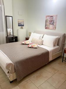 Postel nebo postele na pokoji v ubytování Maria & Zachos House