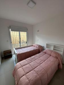 Llit o llits en una habitació de Departamento en Ciudad de Mendoza