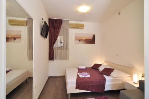 Postel nebo postele na pokoji v ubytování Rooms Palma