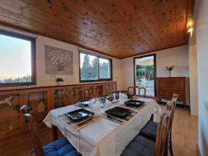 a large dining room with a table and chairs at Cyprus style Stone Villa in Paphos City