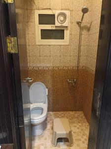 a small bathroom with a toilet and a shower at برج الراية للشقق المخدومة in Riyadh +16 photos