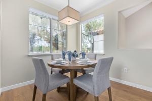 a dining room with a wooden table and chairs at Miller Road 207A townhouse in Scottsdale