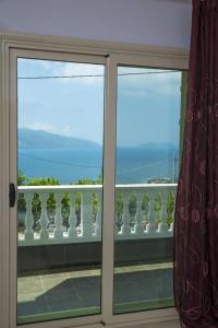 a window with a view of a balcony at 360° View Apartments in Vlorë