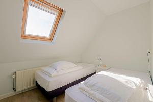 Postel nebo postele na pokoji v ubytování Vakantiehuis De Deining - Callantsoog