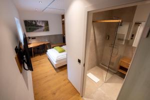 Postel nebo postele na pokoji v ubytování Aparthotel nah dran