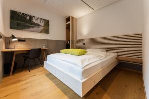 Postel nebo postele na pokoji v ubytování Aparthotel nah dran