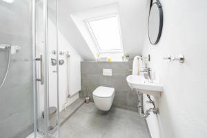 a bathroom with a toilet and a sink and a shower at CNS-b-4-21 - 2-Raum Appartement BalkonGarten in Cappel-Neufeld