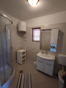 a bathroom with a shower and a sink at Apartment Marta in Jablanac