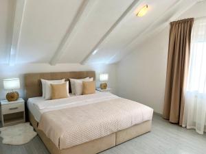 Katil atau katil-katil dalam bilik di Rooms Mirabella