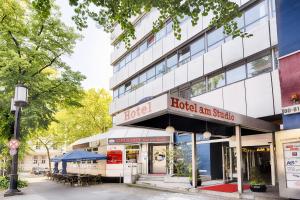 a building with a hotel on the side of it at Enjoy Hotel am Studio in Berlin