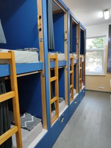 a row of bunk beds in a dorm room at ЛИДЕР ХАУС ХОСТЕЛ in Varna City