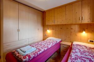 Postel nebo postele na pokoji v ubytování Appartamento Bormetti Paolo