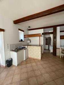 a kitchen with a sink and a counter top at Gite d'Ecosse in Azille