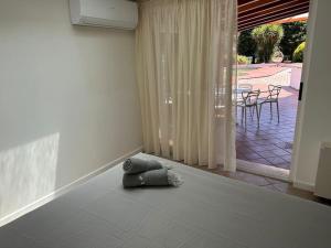 a pillow sitting on the floor in a living room at Villa Belvedere Versilia - Villa con tre camere, cucina, sala, giardino con piscina e vista - 7 posti letto in Camaiore