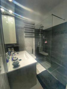 a bathroom with a sink and a shower at Modern 3BDR in Acropolis-Nicosia in Strovolos