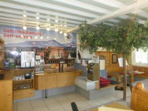 a store with a self service counter in a room at ROSSLWIRT-Rast in Strass im Attergau