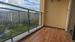 an empty balcony with a view of a building at Zhongzhou International Apartment in Sanya