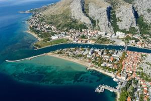 an aerial view of a small island in the water at City, sea and river view, Omis in Omiš
