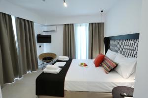 Postel nebo postele na pokoji v ubytování Yianna Hotel