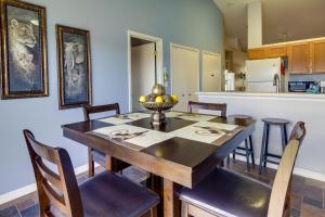 a kitchen with a dining room table with chairs at Clermont Vacation Rental with Community Pool! in Clermont