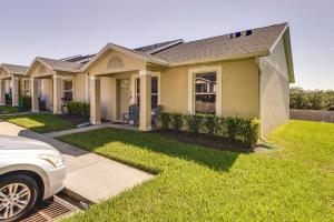 a house with a car parked in front of it at Clermont Vacation Rental with Community Pool! in Clermont