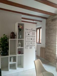 a kitchen with a white refrigerator in a room at Apartamento con encanto Ripalda VALENCIAYOLE in Valencia