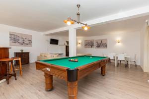 a living room with a pool table in it at Solar Santo Antonio in Palmela