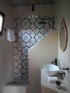 a bathroom with a sink and a mirror at Valia's Beach House in Samos