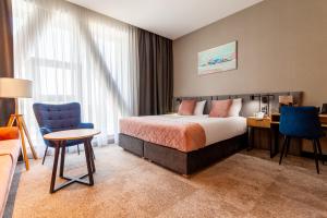 Ένα ή περισσότερα κρεβάτια σε δωμάτιο στο Hotel Sante