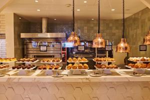 a bakery with many different types of pastries on display at TRS Ibiza Hotel - Adults Only in San Antonio