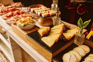 a table topped with cheese and other appetizers at TRS Ibiza Hotel - Adults Only in San Antonio