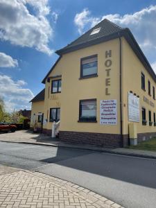 a building on the side of a street at Hotel Villa Vital Munster in Munster im Heidekreis