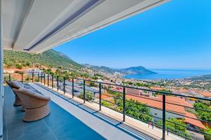 a balcony with a view of the ocean at Hadi Villa in Kalkan