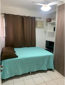 Cama ou camas em um quarto em Alugo Apartamento no Centro de Cuiabá