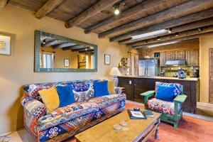 a living room with a couch and a table at Artesano in Santa Fe