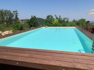 a large blue swimming pool on top of a roof at Casale IL SAMBUCO sui colli bolognesi in San Lazzaro di Savena