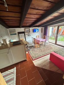 a kitchen and living room with a table and chairs at Cibak House in Liptovský Mikuláš