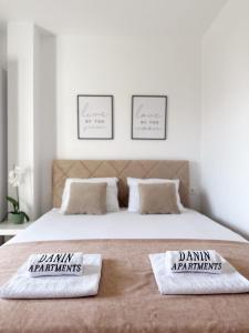 Postel nebo postele na pokoji v ubytování Danin apartmani