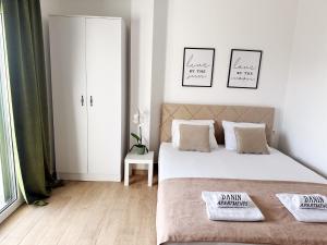 Postel nebo postele na pokoji v ubytování Danin apartmani