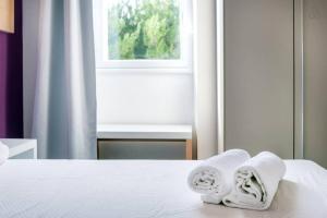Letto o letti in una camera di Oasis Park Hotel