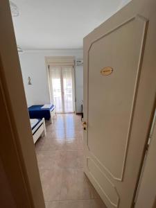 A bed or beds in a room at B&B Kalypso