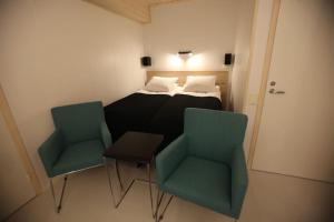 Postel nebo postele na pokoji v ubytování Katajaranta Apartment - Aula