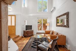 a living room with a couch and a table at Casa Anita in Santa Fe